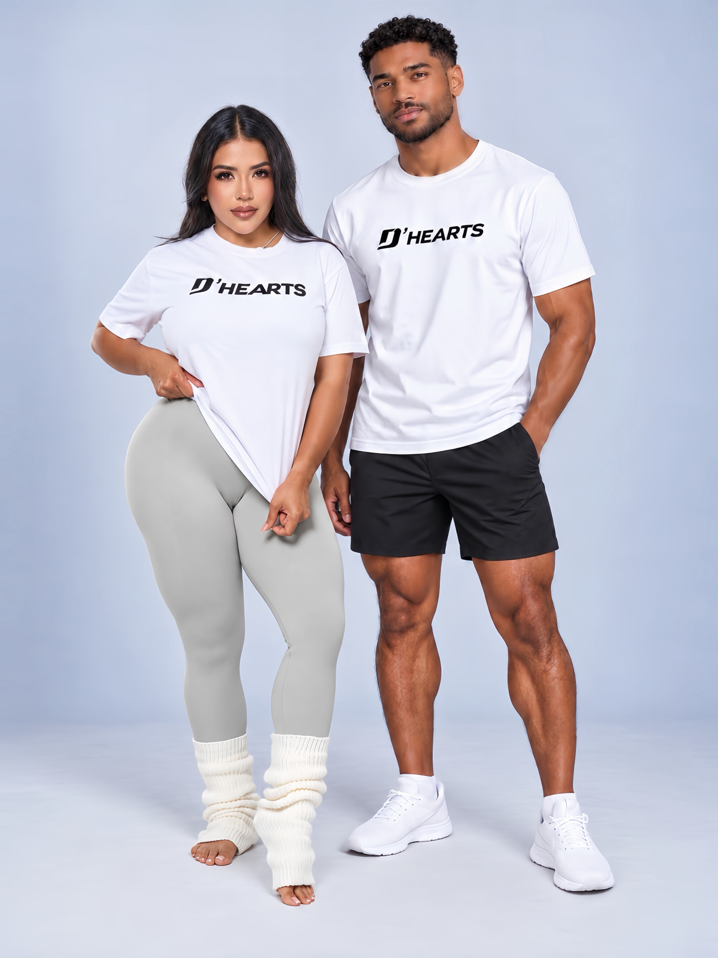 Woman and man wearing matching white D'HEARTS unisex tees